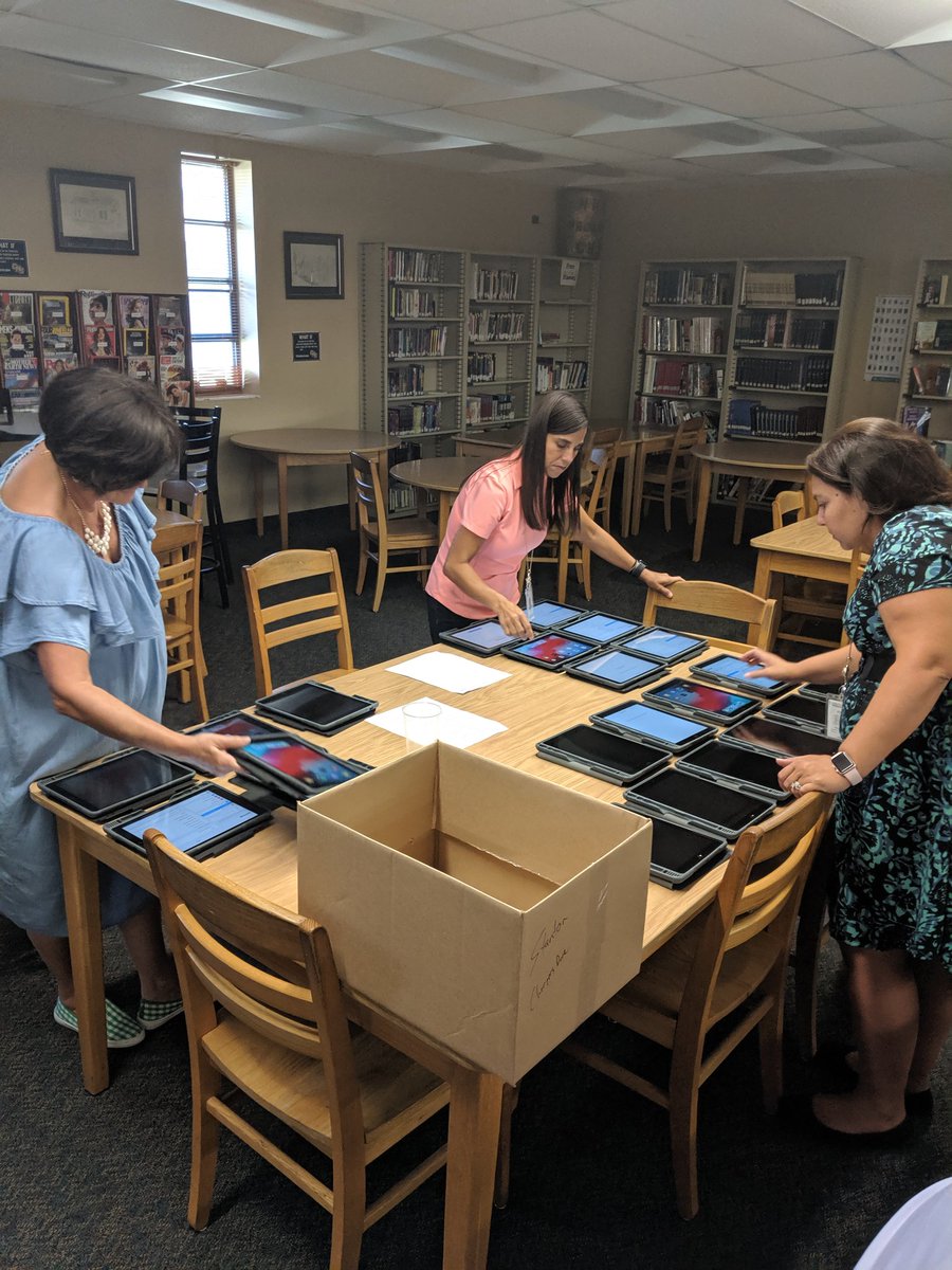 CHSMediaCtr's tweet photo. CHS teachers and staff coming together to set up new iPads for their students #onehurricane #citrushighreads @CHSCanes @CitrusSchools https://t.co/zHx52gnlyX