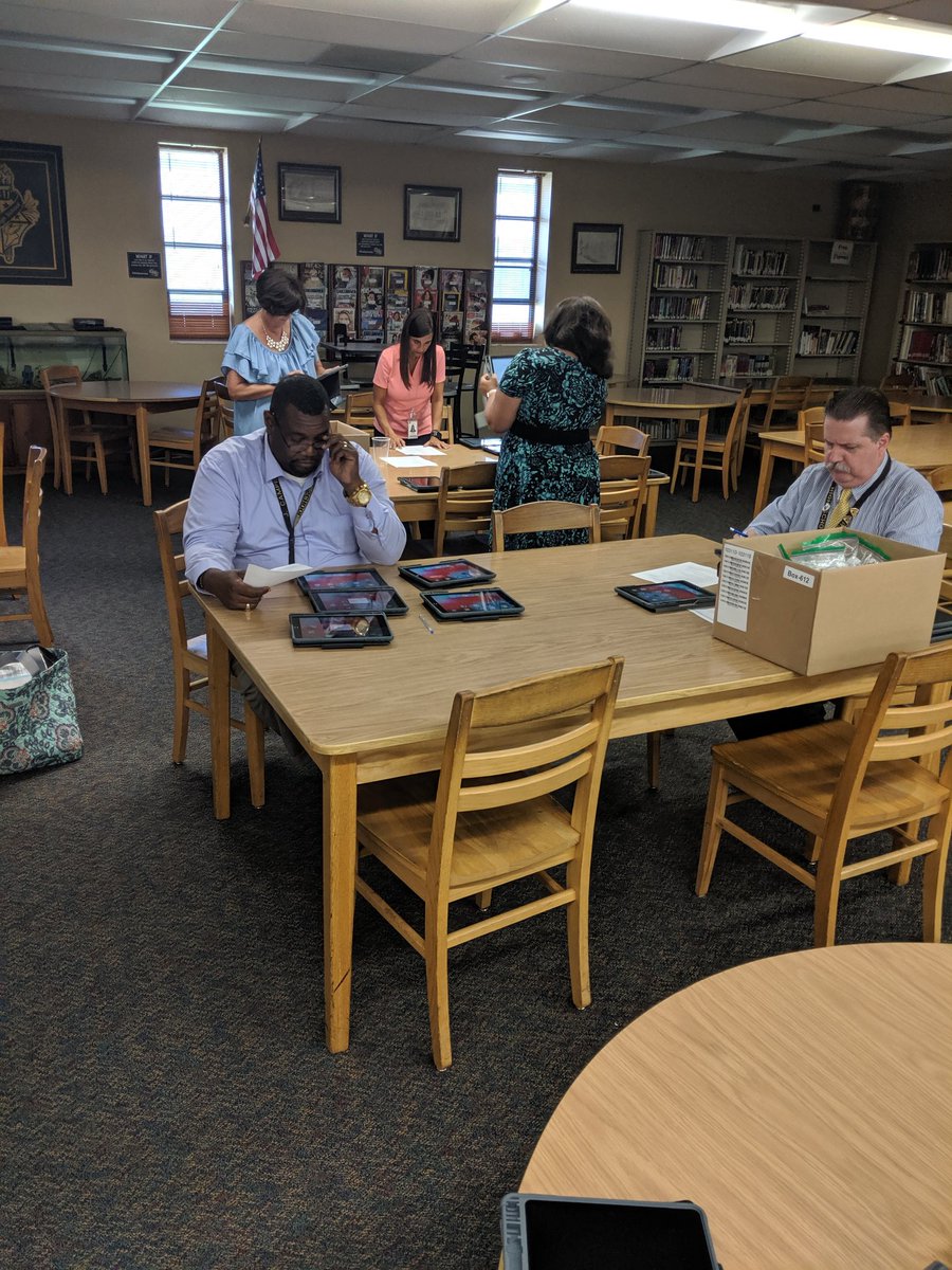 CHSMediaCtr's tweet photo. CHS teachers and staff coming together to set up new iPads for their students #onehurricane #citrushighreads @CHSCanes @CitrusSchools https://t.co/zHx52gnlyX