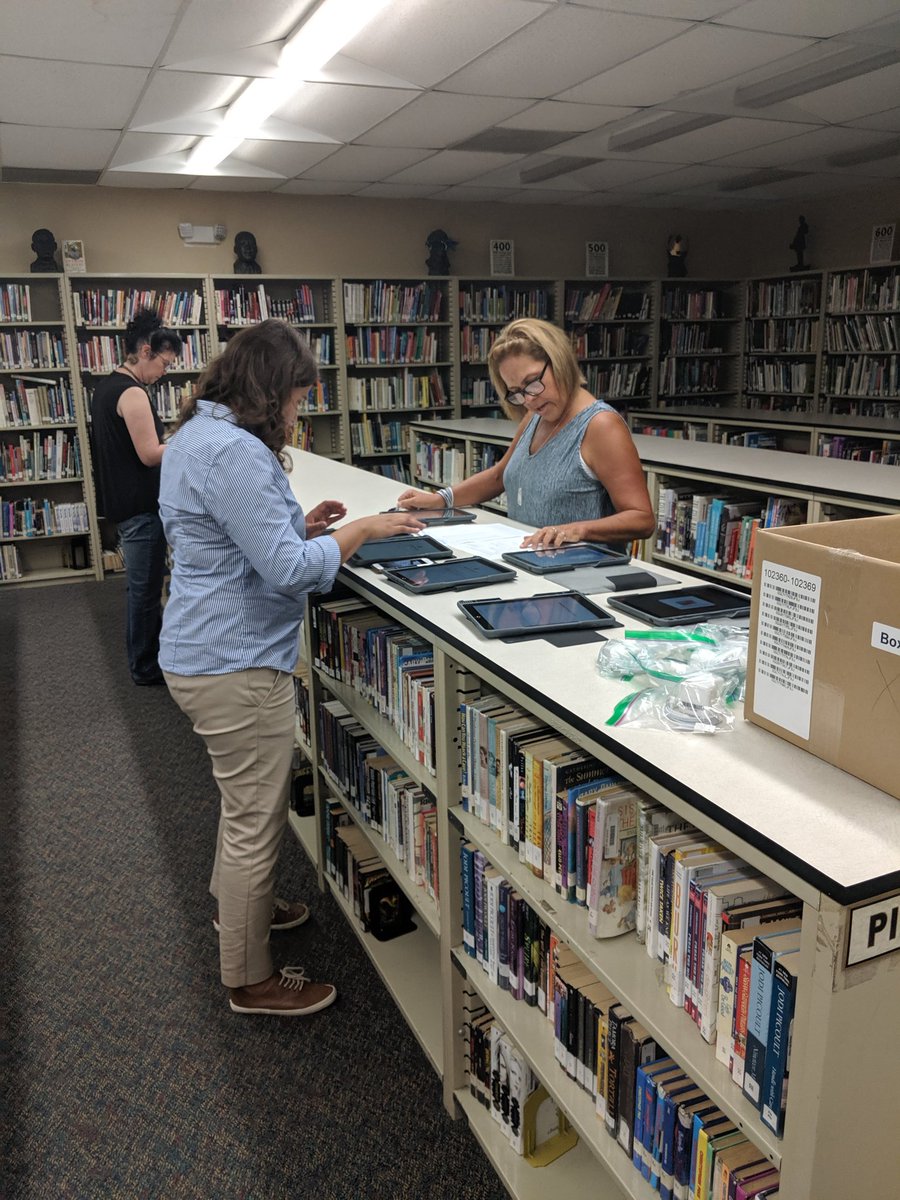 CHSMediaCtr's tweet photo. CHS teachers and staff coming together to set up new iPads for their students #onehurricane #citrushighreads @CHSCanes @CitrusSchools https://t.co/zHx52gnlyX