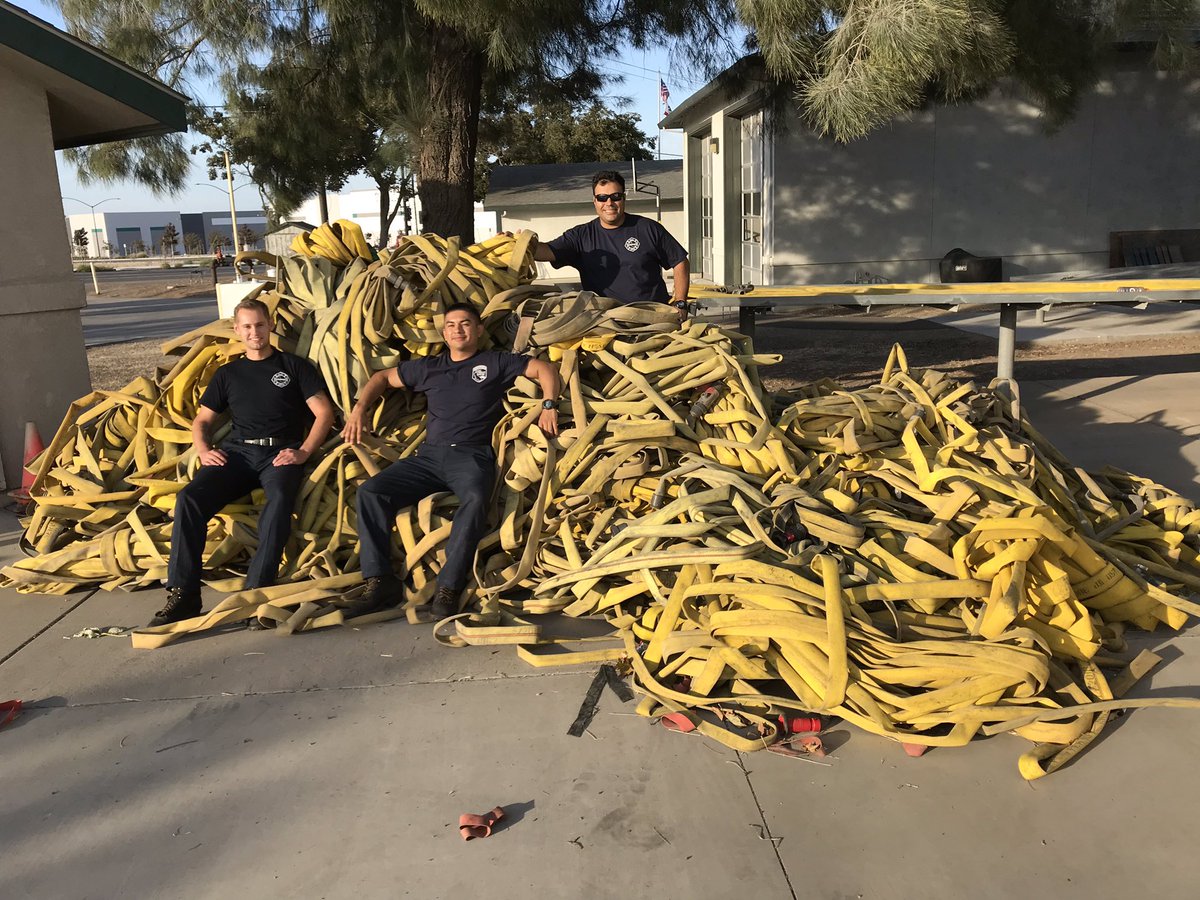 calfireSCU's tweet photo. After every fire comes the clean up! Here the staff at SCU Castle Rock Fire Station get ready to wash, roll and store the hose from the #MarshComplex Any guesses as to how much is there? #wholelottahose #castlerockstation https://t.co/g368yRI1Vj