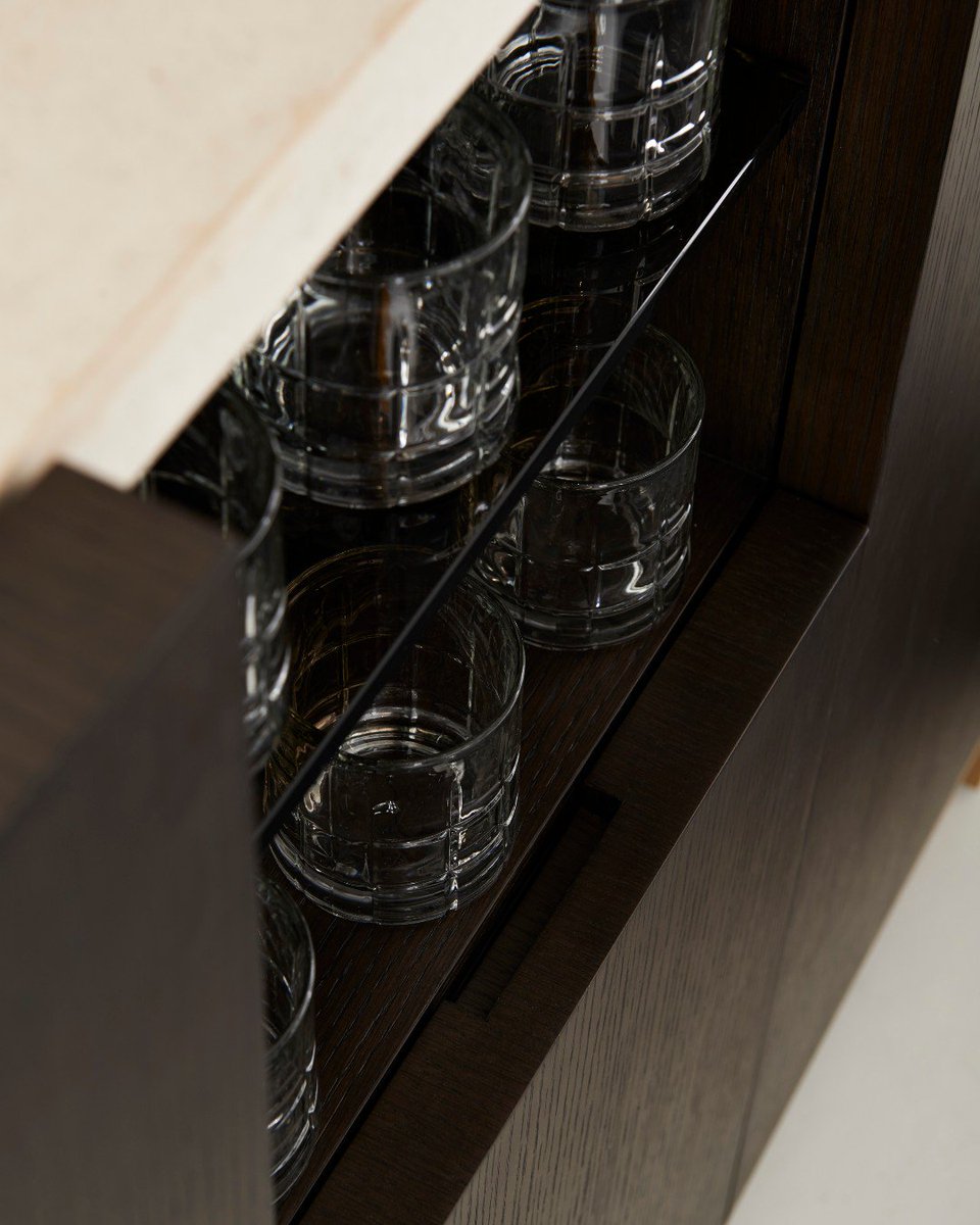 BolierCo's tweet photo. The Bar Cabinet (193005) from the #Objets collection is made of smoked oak with travertine top and bronze base. It also has interior shelves to store bottles and crystal glasses. #BolierCo https://t.co/JouqmsXyKo