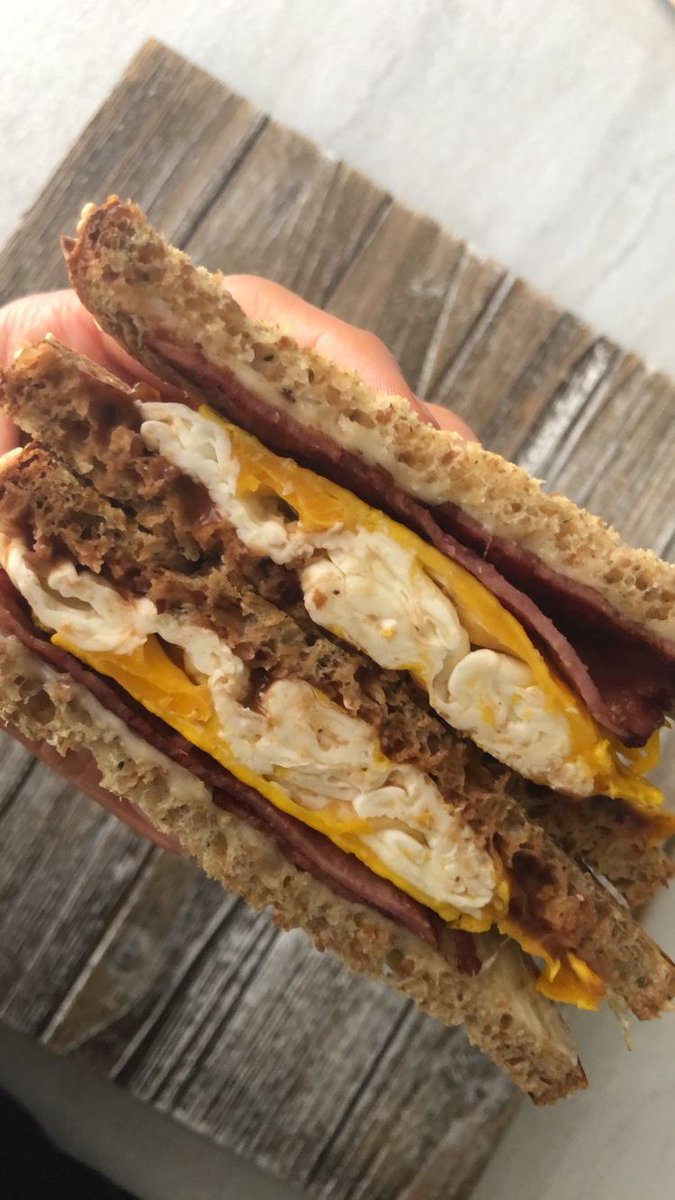 adapted_eats's tweet image. Looks like breakfast but it’s actually going to be lunch. I caught a nasty summer cold and my eating has been a little off. This sandwich sounded like a good choice so I’m having a scrambled egg 🥚, low fat Mozzarella 🧀, a slice of turkey bacon 🥓 all on Flax #ProteinBread.