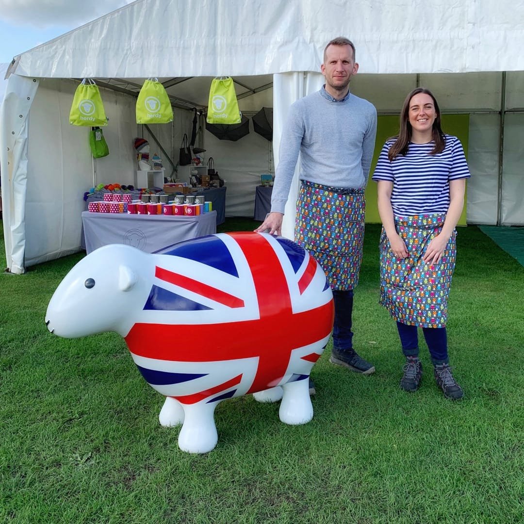 HerdyUK's tweet photo. We're at the @CartmelShow right now, come and say hi! https://t.co/hS53seKwL7

Rich, Sarah, and Giant GB Herdy, with support from Herdy co-founder Spencer, are there to greet ewe. 😇 https://t.co/u68uuHFH8o