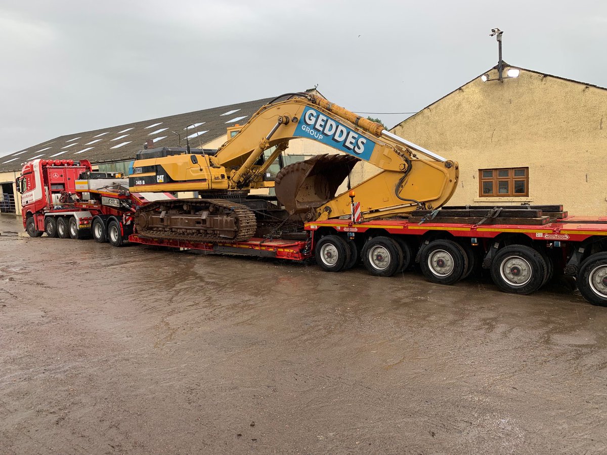 Cat 345 being transported to port then shipped to customer in Netherlands