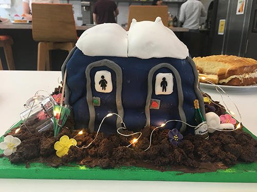 AudleyCareers's tweet photo. This is the winning festival-themed cake (portaloos!) from our London bake sale. We love the addition of the fairy lights. Almost £100 was raised for the British Heart Foundation and research into SADs (Sudden Arrhythmic Death Syndrome). #AudleyLife https://t.co/Jxc8BtWqsy