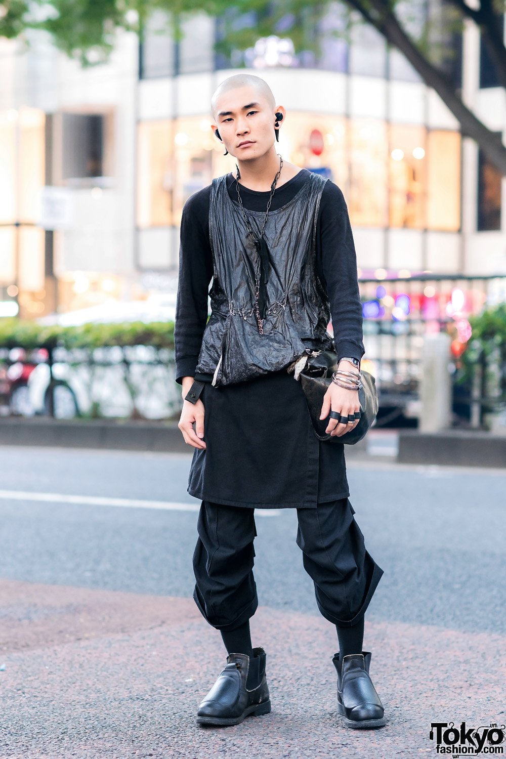 Tokyo Fashion on X Muneyuki off street 0 on the street in Harajuku wearing a dark vintage and remake look with a shiny tank over long tee skirt over cropped pants a deconstructed leather