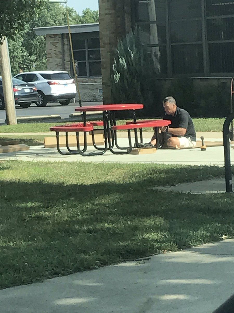 mrsscifres's tweet photo. We seriously have the best principal!  Here he sits, in front of the school, on his own time building a new place for student, parents, staff and teachers to sit. #13Succeeds @13easd @mrstimac https://t.co/pWsFdvhMda