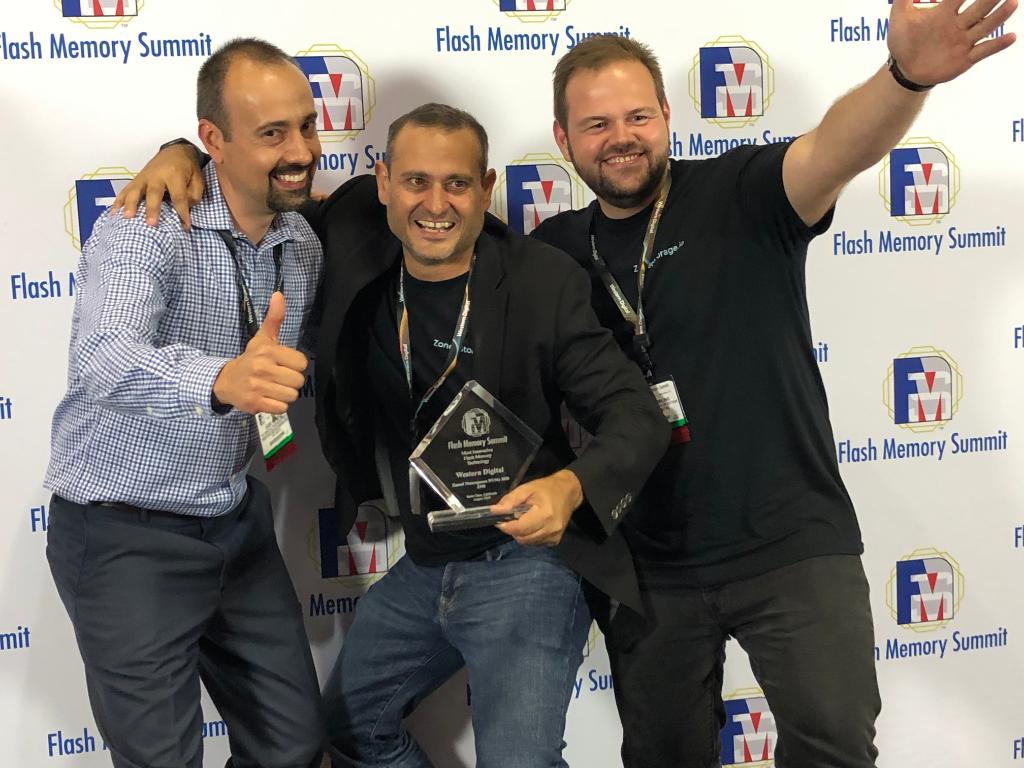 wd_corporation's tweet photo. WE WON! Here's our team receiving a Best in Show award from @FlashMem for our 
"...Implementation of Zoned Namespaces (ZNS) SSD - NVMe M.2 2280 form factor" Wondering what ZNS is? Scroll back through our recent post history! #FMS2019 #FlashMem https://t.co/HvFzosdz0d