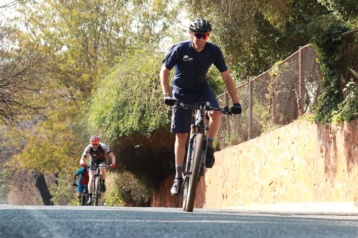 Hollard's tweet photo. King of the Mountain! Checking out our city by bike. Join us for the #HollardJUMA2019 on the 25th August @JUMAMTB #hollardjozitrails #betterfutures https://t.co/5SsyX77vNx