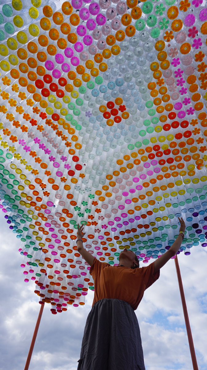 BlackFemArc's tweet photo. 1,600 plastic bottles formed a wavy canopy projecting sunlight through coloured water to create an incredible multi-coloured mosaic mural @BrainchildFest. Who created this might you ask? Our incredible BFA committee member Seyi Adele and we're in absolute love 💕 https://t.co/6GSfy8UX1z