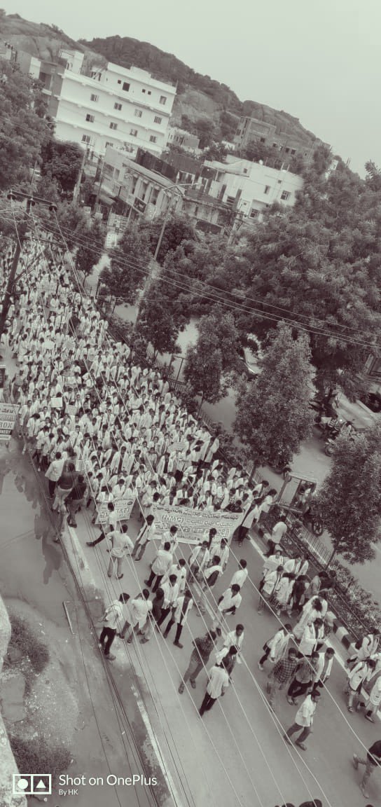 Rricha9's tweet photo. White Aprons flooding broken roads. This is NOT how the face of the Largest Democracy is supposed to look like. #HataoNMC #SayNoToNMCbill #NoToNMCBill https://t.co/u3OiAEQdOo