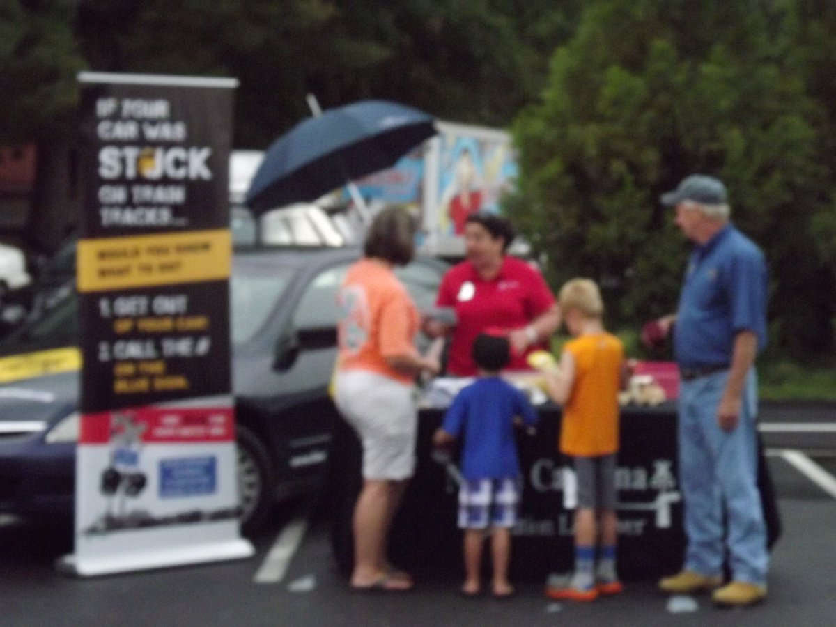 OL_NC's tweet photo. Tuesday was #NationalNightOut and #OL_NC's Margaret Cannell was in #Gibsonville sharing #RailSafety information! A #littlebitofrain didn't stop the fun! #OLI https://t.co/ZEyFAf9WZl