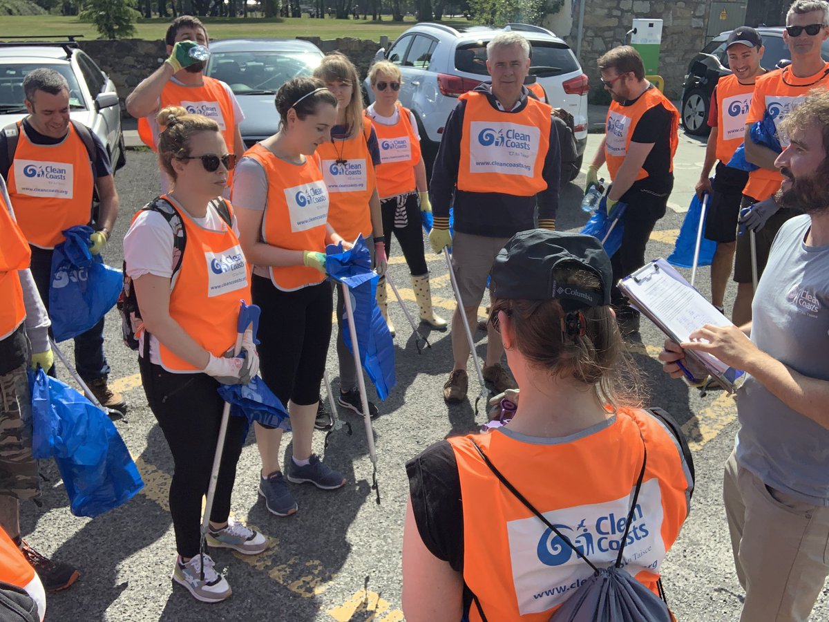 PatrickMooney's tweet photo. What a fun team day GIVING back. It’s our global GIVE day where we get to volunteer. The team focused on a beach clean up and we got the most perfect day for it. #UXDS https://t.co/i2OvNj9sJn