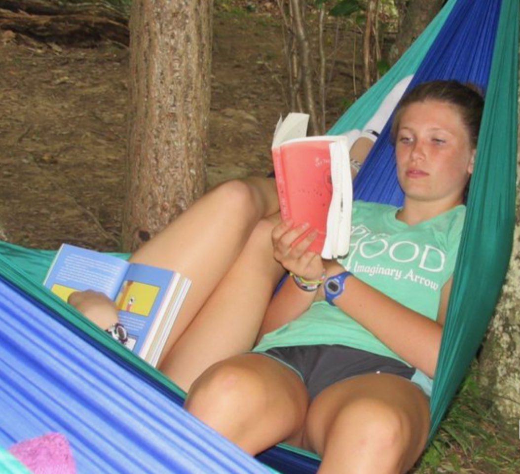 fitzbtwnshelves's tweet photo. What does a head library intern do to relax after a full year running things behind the desk? Enjoy her #stabsummerreading in a hammock at camp in West Virginia, of course. Gotta love those #summervibes ☀️ 💕 https://t.co/wxzKGXYcvL