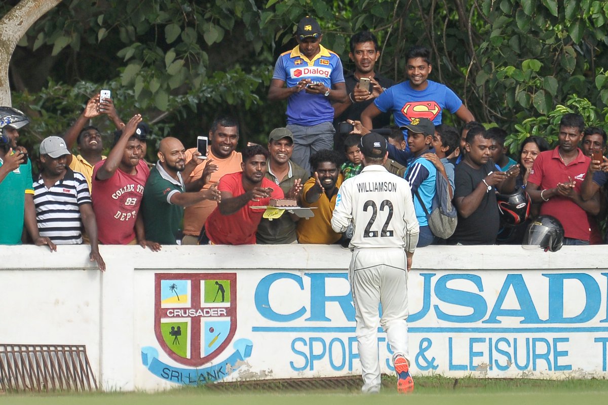 OfficialSLC's tweet photo. What a way to celebrate the Birthday! Kane Williamson celebrates his 29th with Sri Lankan fans eating a piece of Cake with them during the warm-up! @BLACKCAPS https://t.co/WyzZ86NUVH
