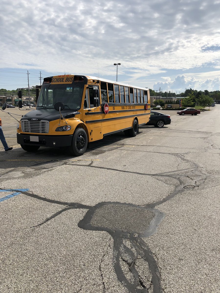 One of our new buses parked in front of Mario’s barbershop at the corner of Pleasant Valley and Broadview for the “Stuff a bus” with school supplies event.