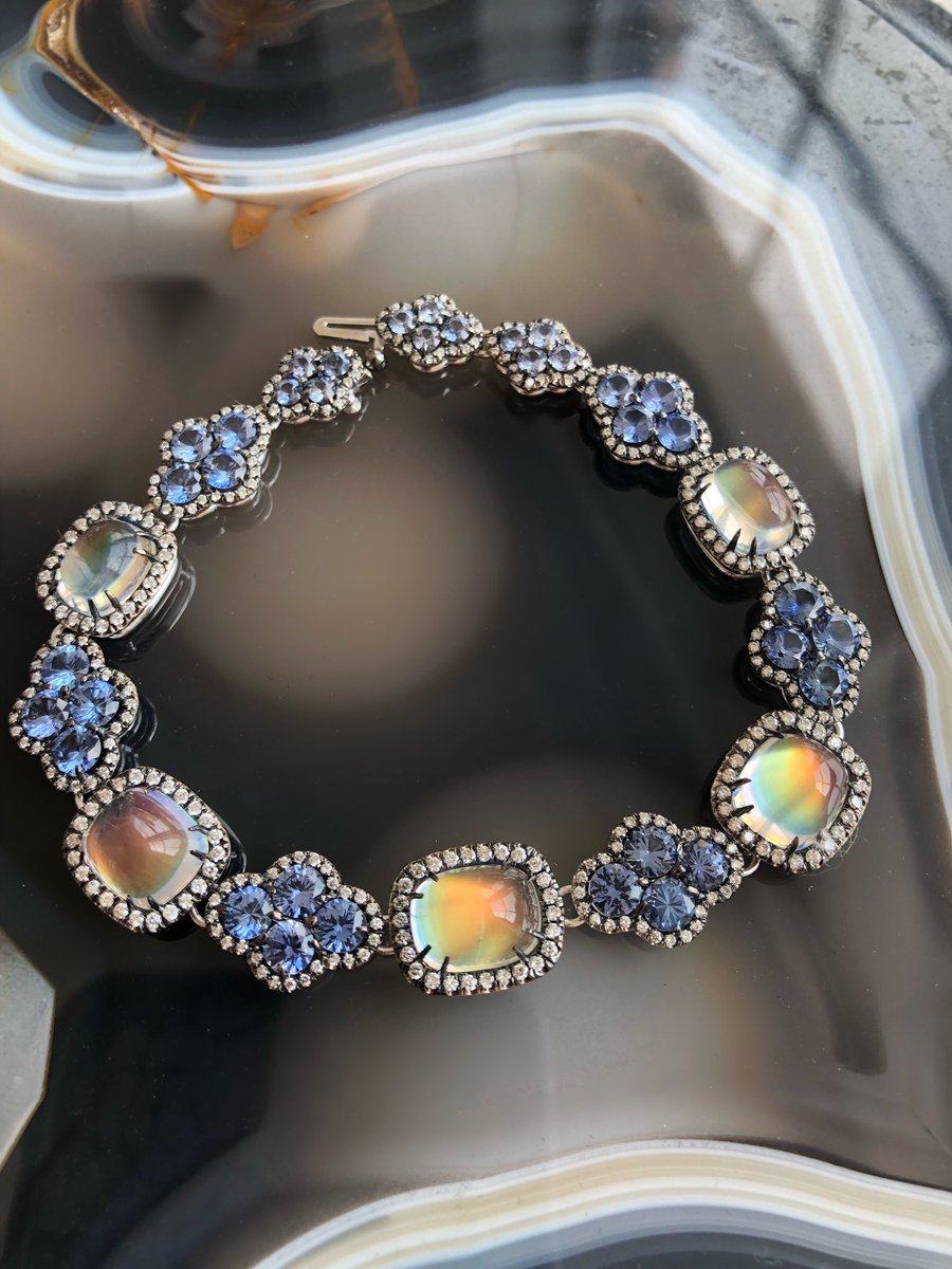 JAjewelryinfo's tweet photo. It comes as no surprise that this rainbow moonstone, blue sapphire and diamond bracelet by @CampbellianNYC took first place in Bridal Wear category at #AGTAspectrum19 🏆 How mesmerizing is this bracelet!? #JAmember #buyjewelry #IamJA #WeAreJA https://t.co/JhX6QHYOnY