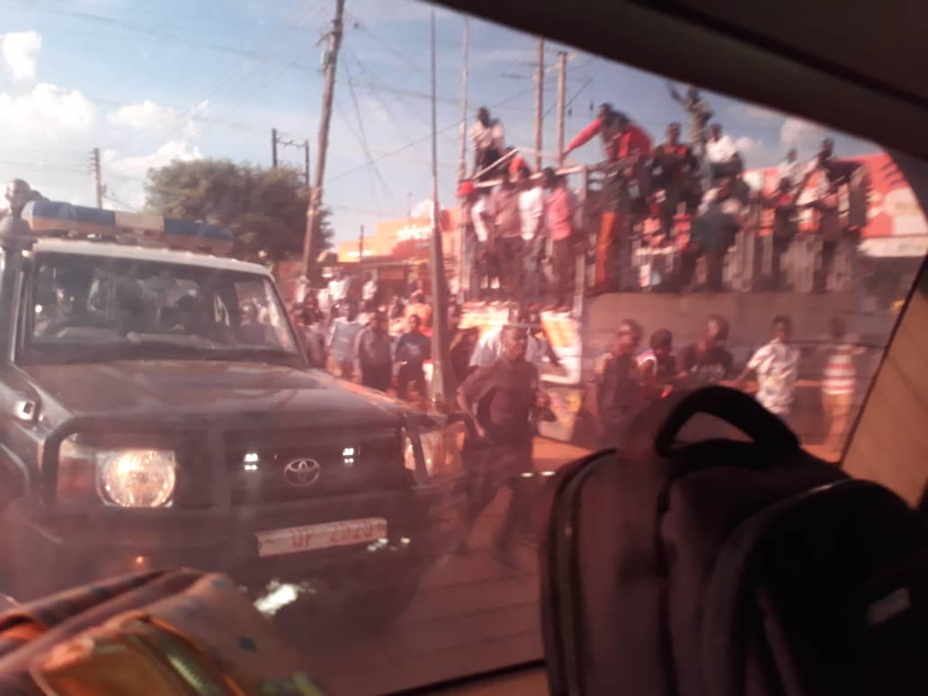 JoelSsenyonyi's tweet photo. As we returned from Gulu court on Tuesday,supporters cheered us all the way.Police officers kept beating pple on roadsides with sticks &amp;in Bombo,police truck UP 2525 hit a boda rider to push him off the road.Hakeem Sekamwa died &amp;today we buried him in Luweero.This evil must stop! https://t.co/bMZQmu8YyV