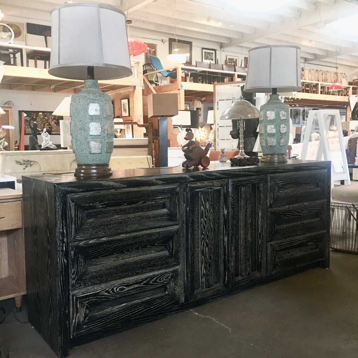 galeriesommerla's tweet photo. Dresser by Lane featuring a rare, attached pair of mirrors that rest above a set of doors concealing 3 drawers with 3 additional drawers flanking each side. Cerused finish that highlights wood grain. Stamped "Lane Altavista, Virginia" in drawer. 30"1/2 , (71"1/2 with mirror) https://t.co/NncbzK6bfW
