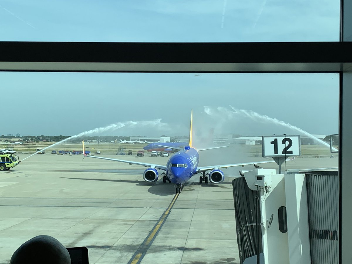 The entire terminal has come to watch this arrival.