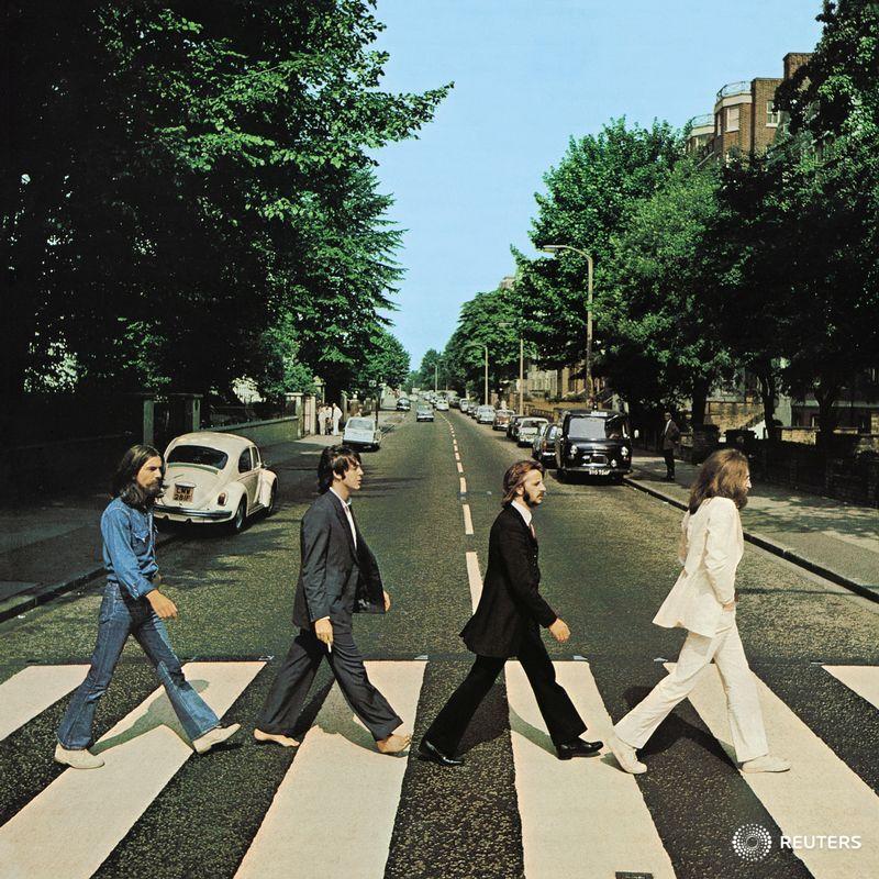 Reuters's tweet photo. Fifty years ago today The Beatles were photographed crossing a leafy street in north London, creating one of the most famous album covers in music history and an image imitated by countless fans ever since. https://t.co/4FOjCUDa8p https://t.co/17TuAgEWNf