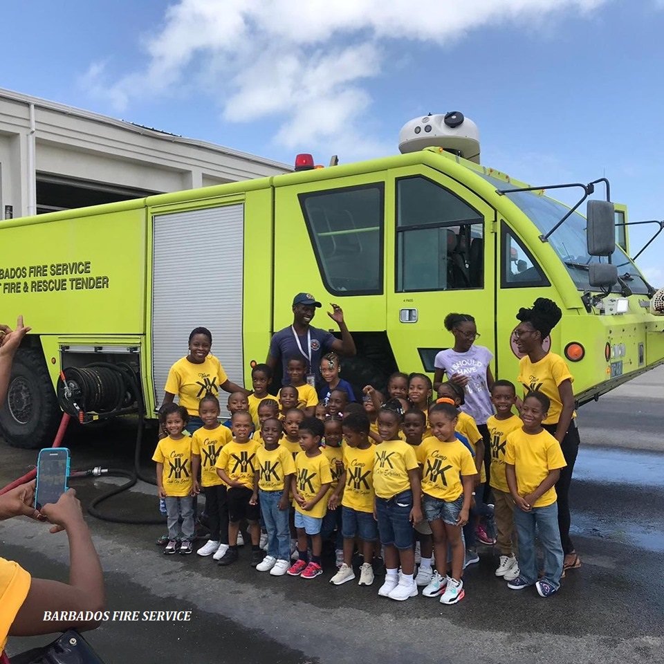 FireService246's tweet photo. K and K Child Care Service Summer Camp made a visit to the Airport Fire Station. The campers were able to learn about aerodrome fire and rescue as well as see aircraft arriving and departing Grantley Adams International Airport (GAIA). #Barbados #BarbadosFireService #SummerCamp https://t.co/fjnEn3oGQZ