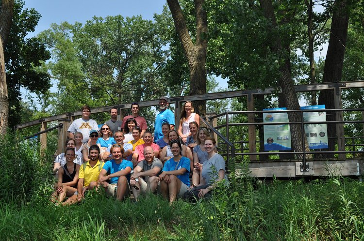 Group of people sitting on steps outside