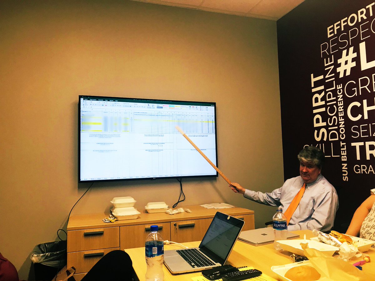 MsMollyCastner's tweet photo. Little Rock Athletics Compliance Team hard at work. No laser pointer? No problem for Richard. #GRIT https://t.co/dBEsi0zsZv