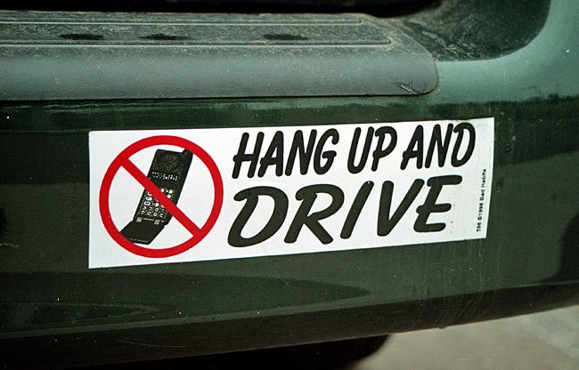 Check out that old school phone! Stay safe out there on the roads. #BumperStickerofTheDay 🚗 😂 #mccurrydeck #safety #oldschoolphone #notalkanddrive #hangupanddrive #forestcity #safetyfirst