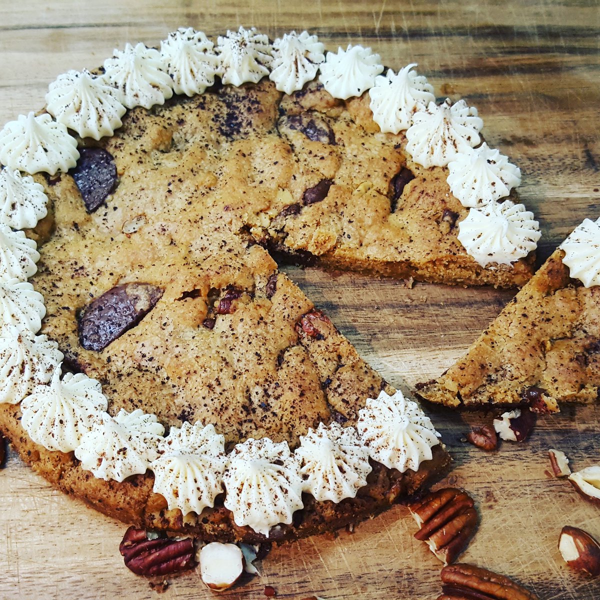 Our take on Millies Cookies giant cookie. Dark chocolate, hazelnut and pecan cookie with buttercream frosting. Made today with my teen! He made the cookie, I iced it and we all ate it! 😋💚🌱 #veganfoodlovers  #vegan #veganaf #veganfoodshare #veganfood #dairyfree #easytobevegan