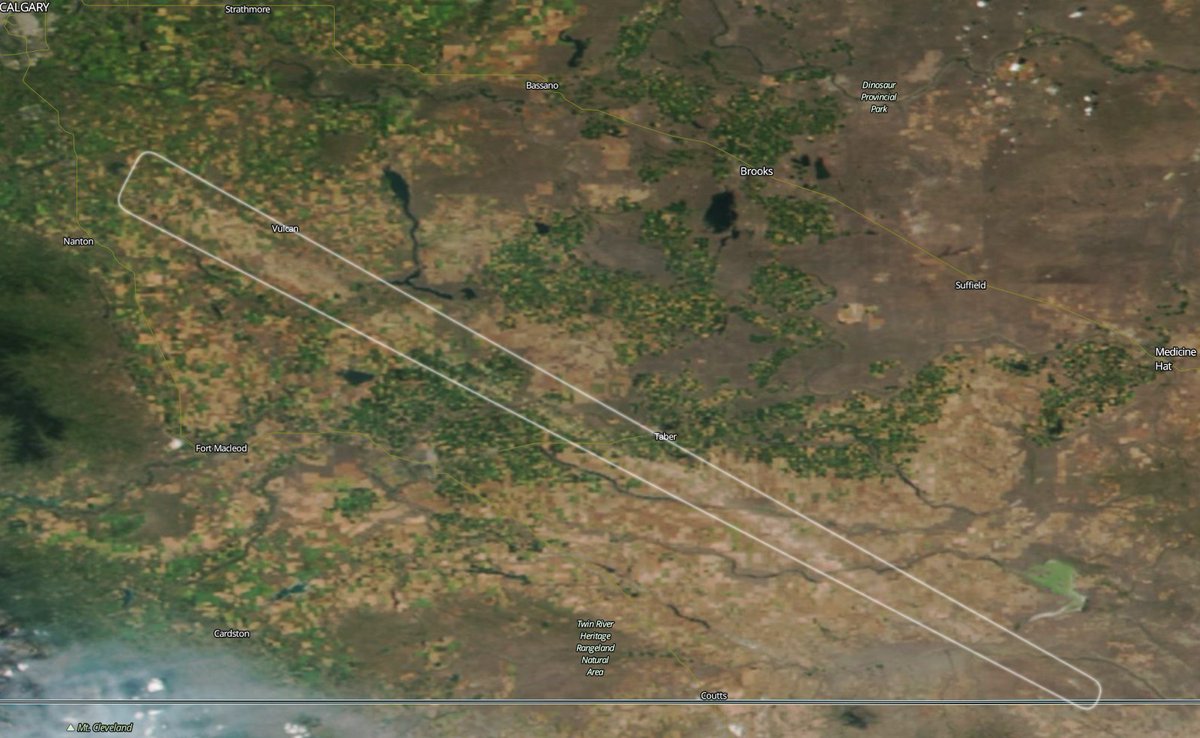 With a clear view from above, the August 6 #abstorm hail track through southern #Alberta is much longer than previously thought. Starting west of Vulcan and running for 250km, almost to the US border. 2nd worst hail track I've ever seen.   worldview.earthdata.nasa.gov