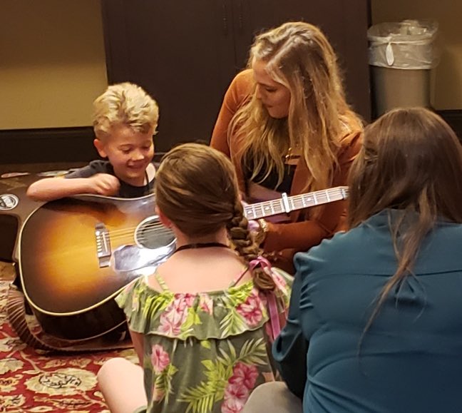 opry's tweet photo. Emily &amp; Timmy got a guitar lesson they’ll never forget backstage at the #Opry tonight thanks to @Lauren_Jenkins! 🧡🎸 https://t.co/4ulBDuyGI6