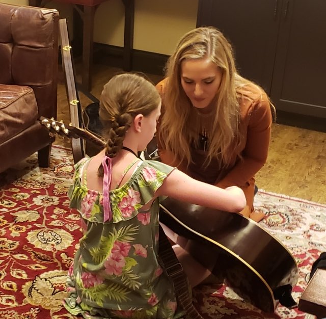 opry's tweet photo. Emily &amp; Timmy got a guitar lesson they’ll never forget backstage at the #Opry tonight thanks to @Lauren_Jenkins! 🧡🎸 https://t.co/4ulBDuyGI6