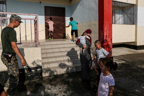 Newsenm's tweet photo. AKTAU, Kazakhstan — The young woman said she thought she was going on vacation in Turkey, but instead found herself in Syria, tricked, she said, by her husband, who joined the Islamic State. She herself, she said, never subscribed to ISIS teaching. #ENMN https://t.co/vn7Szd8cQj https://t.co/KKH0kuT8R2