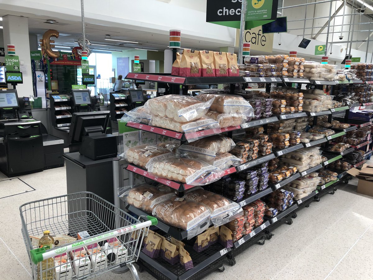 RobTannerUK's tweet photo. @HughFW cracking tactic from Asda; remove the sweets but stack the self-service checkouts full of cakes instead! #wallofcake https://t.co/lwrKHKM0JJ