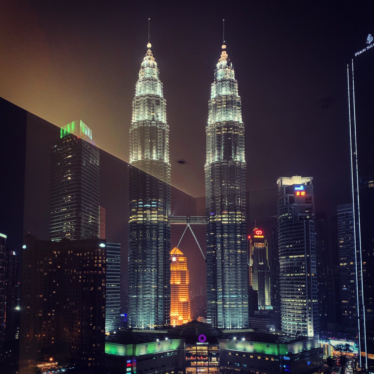 tweetadithya's tweet photo. I just opened our hotel room’s curtain to Kuala Lumpur’s Crown Jewel - The Petronas Towers! 🤩#ShangriLa #TwinTowers #iPhoneXsClick #KLScenes https://t.co/q0ywlnoThf
