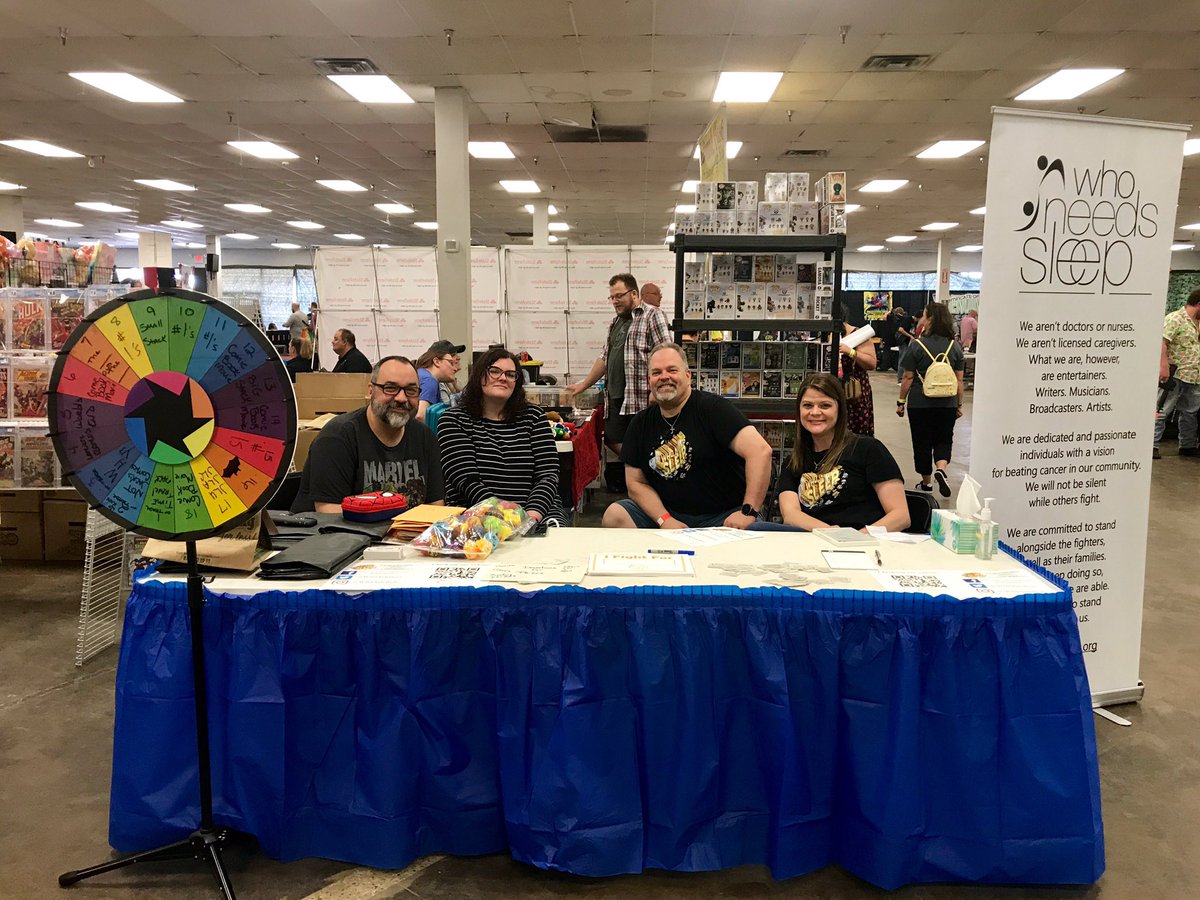 WNSTelethon's tweet photo. Your Who Needs Sleep crew for the day. Everyone who makes a donation will get a chance to spin the wheel for a great prize. You can also sign up for the cosplay contest at our booth. #WNS2019 #AskMeWhyIDoThis @dallascomicshow #DallasComicCon https://t.co/6CzshEE87P