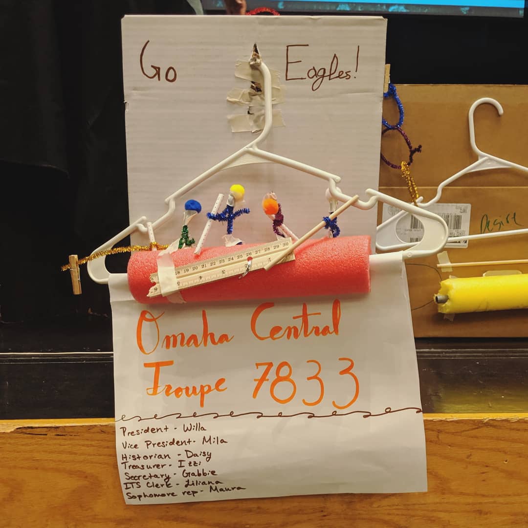 OnlineCallBoard's tweet photo. Four of our officers at the Millard West leadership retreat, along with the most beautiful masterpiece ever created: sparkly figures rowing a boat together, depicting our core values of teamwork, creativity, and efficiency https://t.co/zjFngFhndt