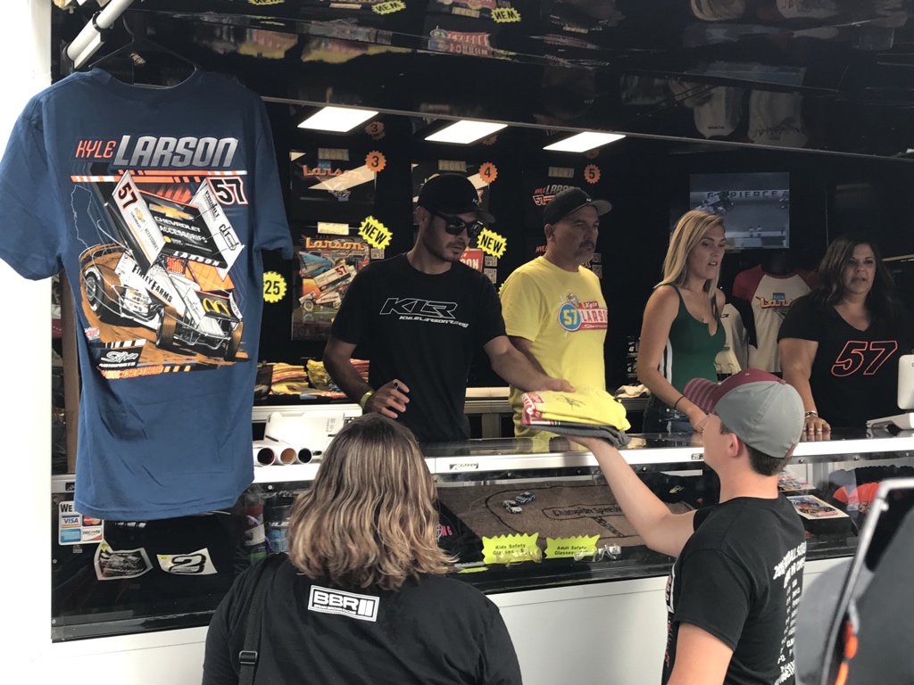 Kyle Larson has returned to Knoxville as a spectator. Here he is signing autographs at his merchandise trailer.