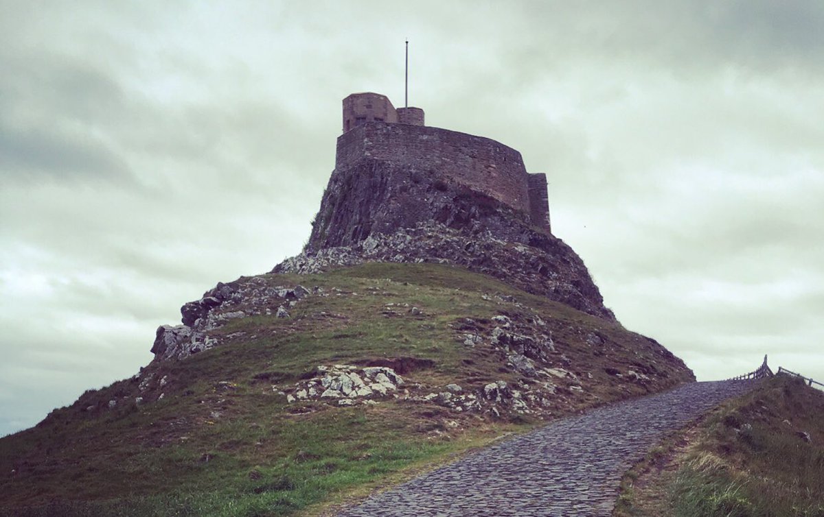 NTlindisfarne's tweet image. Think today’s weather could kindly be described as ‘atmospheric’! If you’re already on the island (the causeway is closed now)- inside the castle is dry &amp;amp; there are some lovely coffee shops on the way! (Waterproofs available from our NT shop in the village). Castle open until 4pm