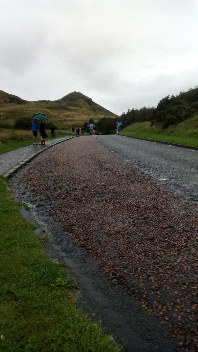 DaveTheBook's tweet photo. QoM finish in Holyrood Park. It might be raining, but at least the wind is having a day off. #WTOS https://t.co/OoSk1icNAN