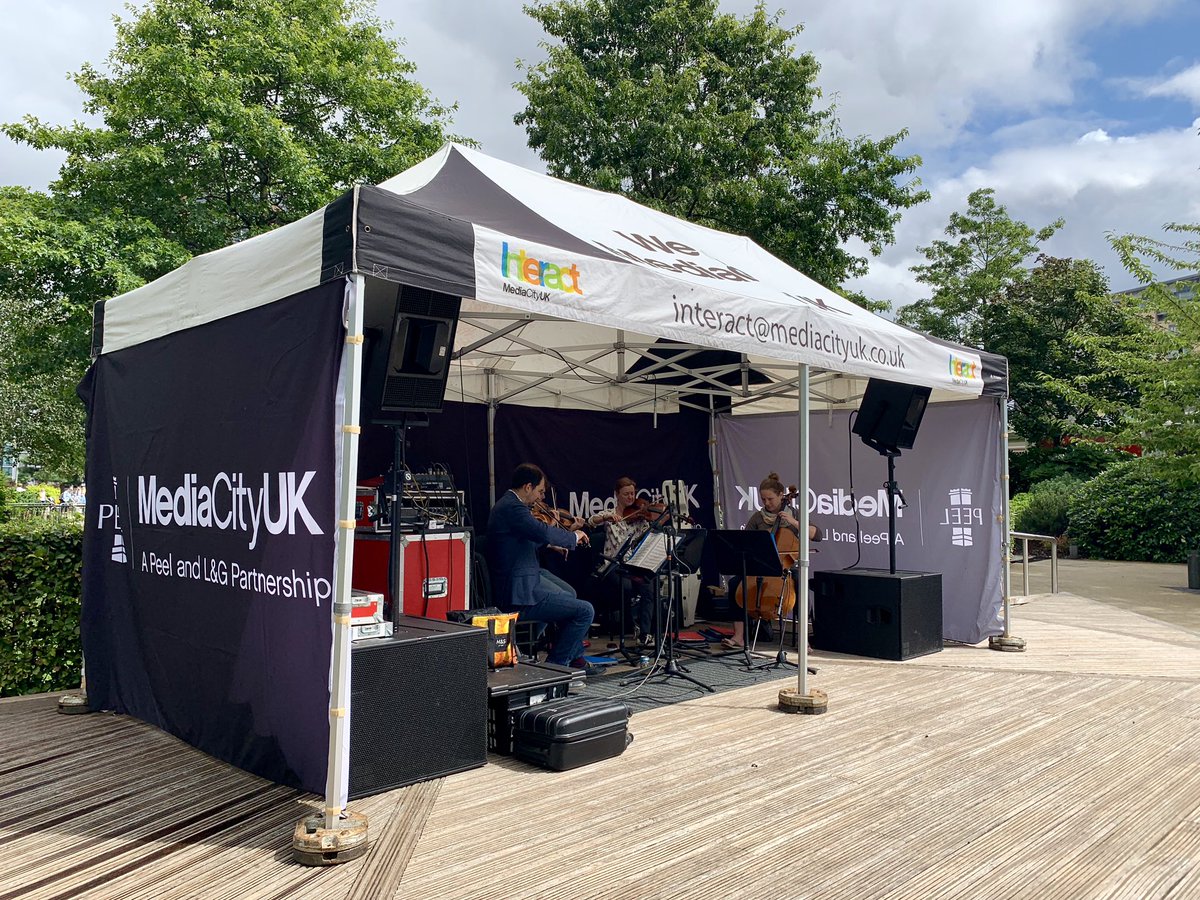 MediaCityUK's tweet photo. The sun is even beginning to come out for the final day of @MediaCityUK’s #SummerWeekender!
Make sure you catch the @BBCPhilharmonic’s String Quartet live on the bandstand! https://t.co/7XoskWvITA