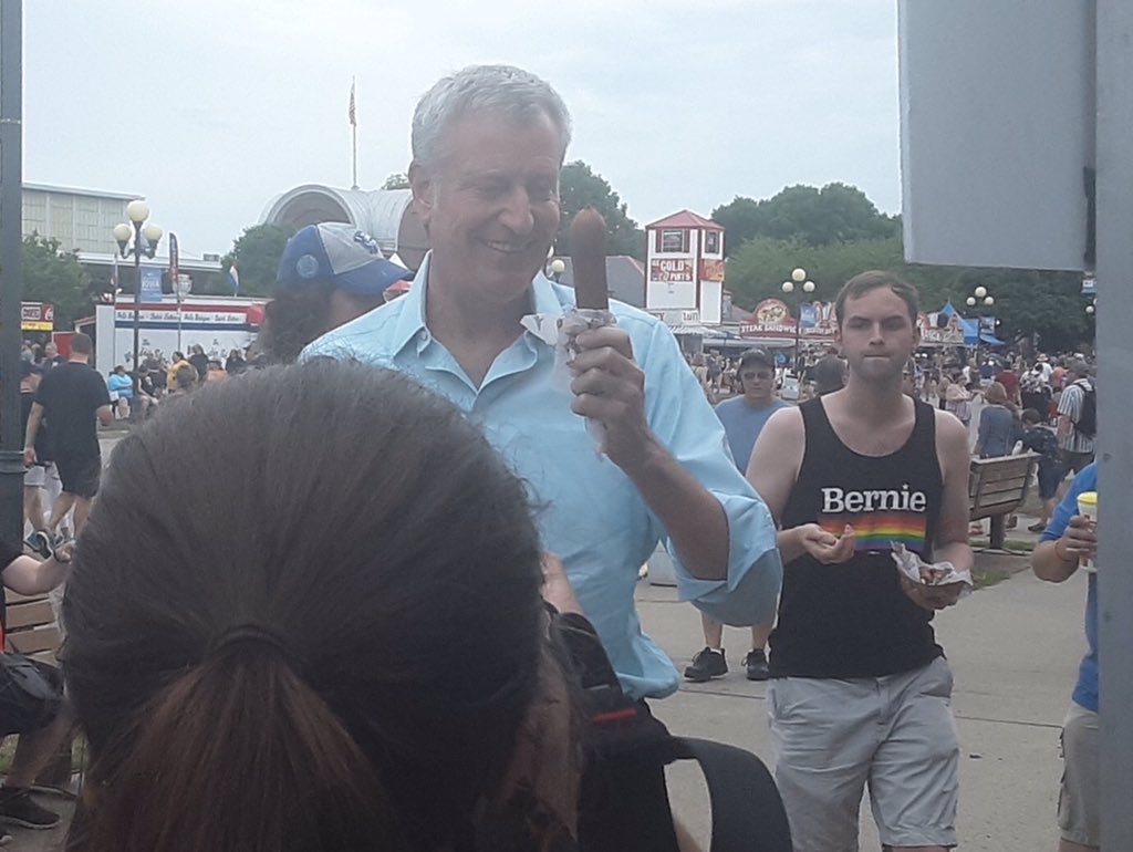 FL4Bernie2020's tweet photo. @PaigeGodden @IAStartingLine Love the Bernie supporter in the Bernie pride tank top w/the inadvertent photo bomb!!! #Bernie2020 #IowaStateFair #IACaucus #BerniePride #Equality #LGBTQPride π #BernieInIowa https://t.co/0pkYgHMh0t