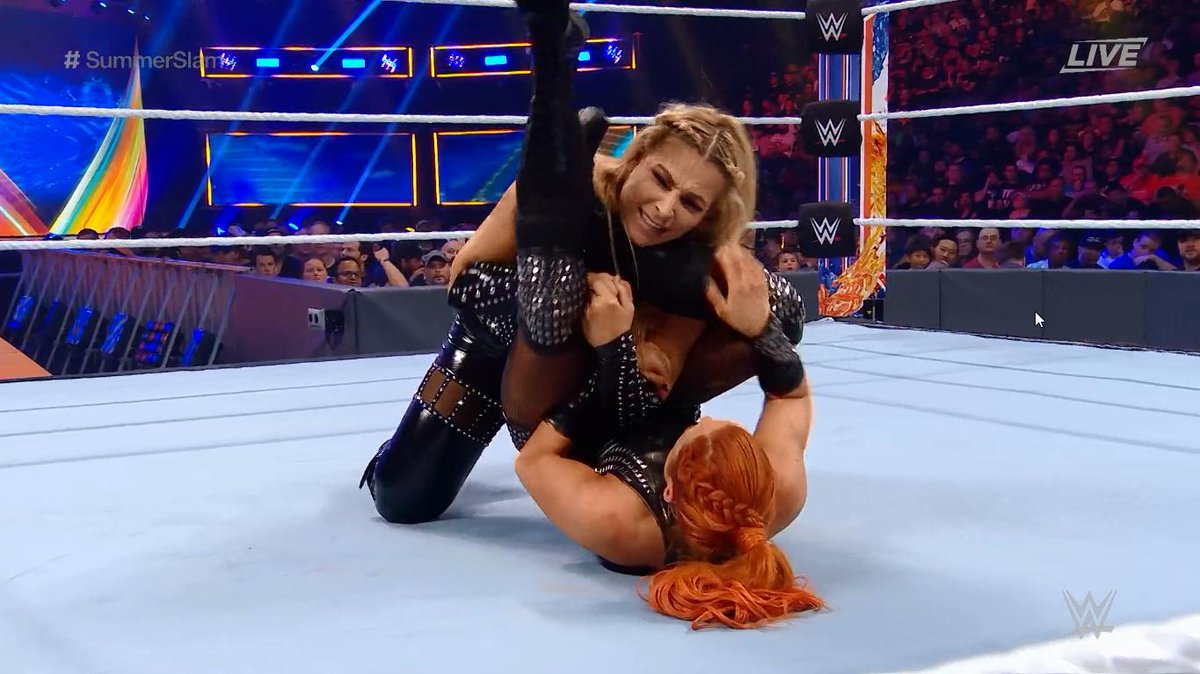 WWEIndia's tweet photo. .@BeckyLynchWWE tries to secure an early victory by hitting the #DisArmHer
#SummerSlam https://t.co/I24OSyHeuF