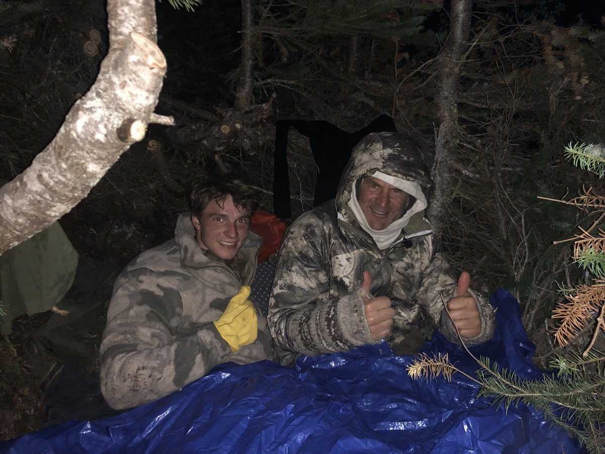 JimShockey_'s tweet photo. Temperature is dropping like a rock. Starting to rain. Wind is howling and we are stuck on the mountain. Too far back to spike camp, water almost gone, no food left....and life is unfolding perfectly! We have a tarp! https://t.co/mGMGKi4YGB