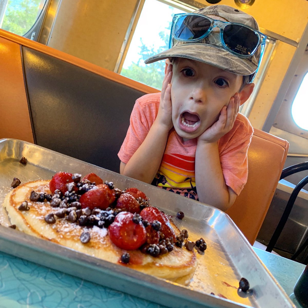 TexasBucketList's tweet photo. My boy was somewhat impressed with the pancakes at Hullabaloo Diner! #thetexasbucketlist #breakfast #experiencebcs #pancakes https://t.co/WZTC6jU5Us