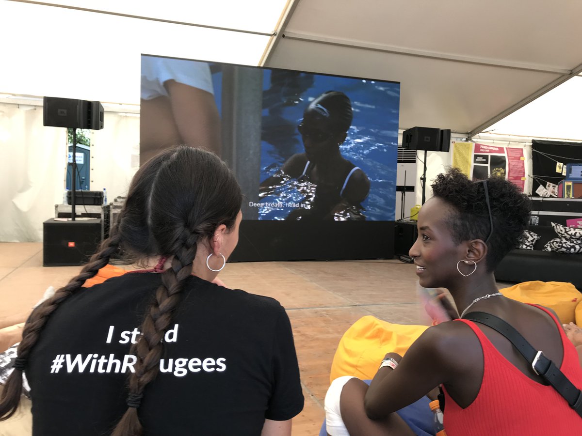 Embrrrr's tweet photo. Kafiya, the young Somali refugee turned into a successful fashion model in Hungary is watching “Easy Lessons”, the documentary about herself in #TentWithoutBorders at #SzigetFestival @szigetofficial.
We’ll have a live Q&A with her very soon. Don’t miss it! https://t.co/Iooxm0hkNS