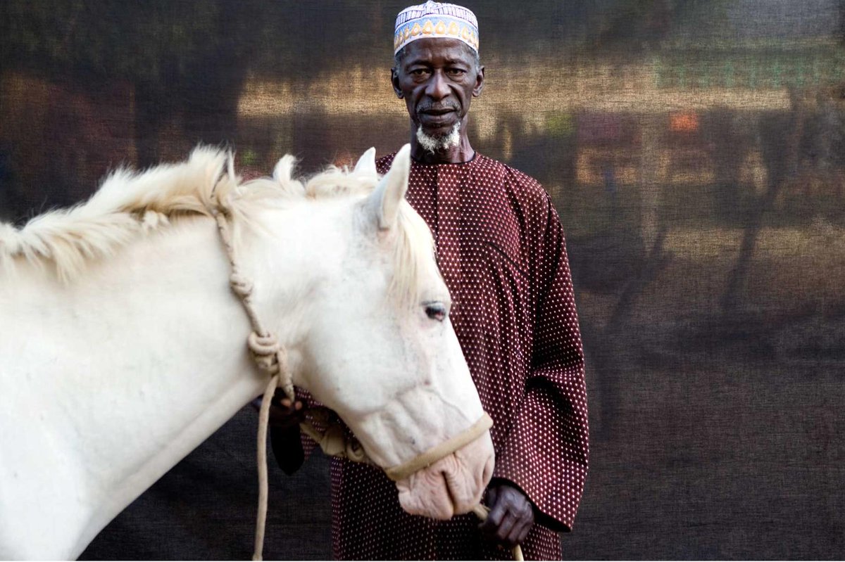 floriophotoNYC's tweet photo. '#Silafando-a gift to you on behalf of my journey' Acting #Alkalo Herouna Tonkara, The #Gambia, #WestAfrica #portrait ©Jason Florio. In 2009, I co-led with Helen Jones-Florio the 1st recorded circumnavigation of Gambia by foot, a 930 km journey https://t.co/kbGGhDViCa https://t.co/RkoUHu4HCB