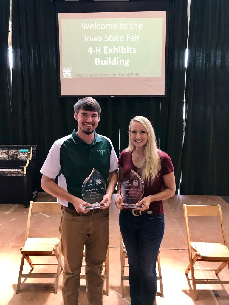 corteva's tweet photo. #Farmfluencer grand prize winners Hannah Riensche and Matthew Sperry accepted their awards at the @IowaStateFair this past weekend. Congratulations to you both and #KeepGrowing! https://t.co/m7Xiyoo3dT