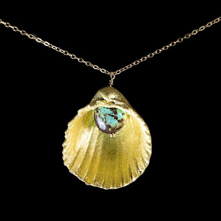 AAONYX_Dimitri's tweet photo. The 'Golden Shell' is a 22k solid gold layer over a gorgeously smooth Costa Rican shell.  A beautiful Turquoise stone hangs gracefully from the center.  This is the first offering of gold from our summer Tica Line.  The chain is a 14k gold filled oval design. https://t.co/Orh1jsXank